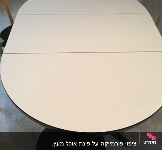 Oval table with wooden chairs around it